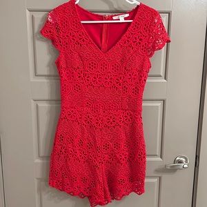 Red eyelet romper with cap sleeves